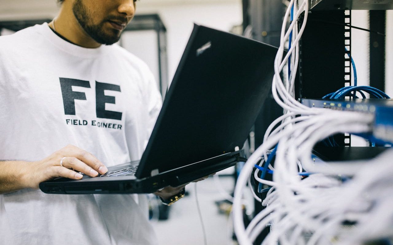 Photo by Field Engineer: https://www.pexels.com/photo/serious-ethnic-field-engineer-examining-hardware-and-working-on-laptop-442152/